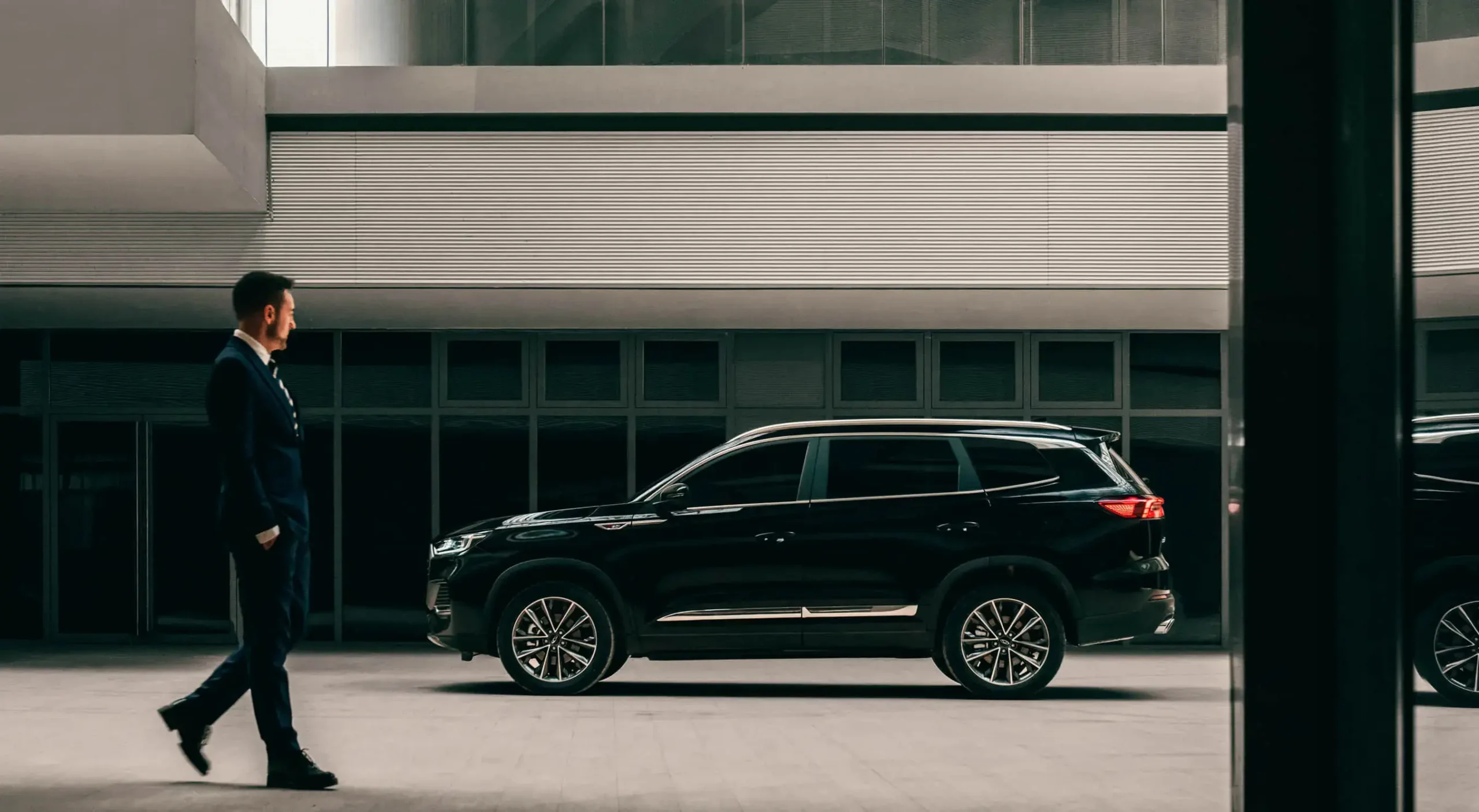 tiggo pro max 8 man walking by car image